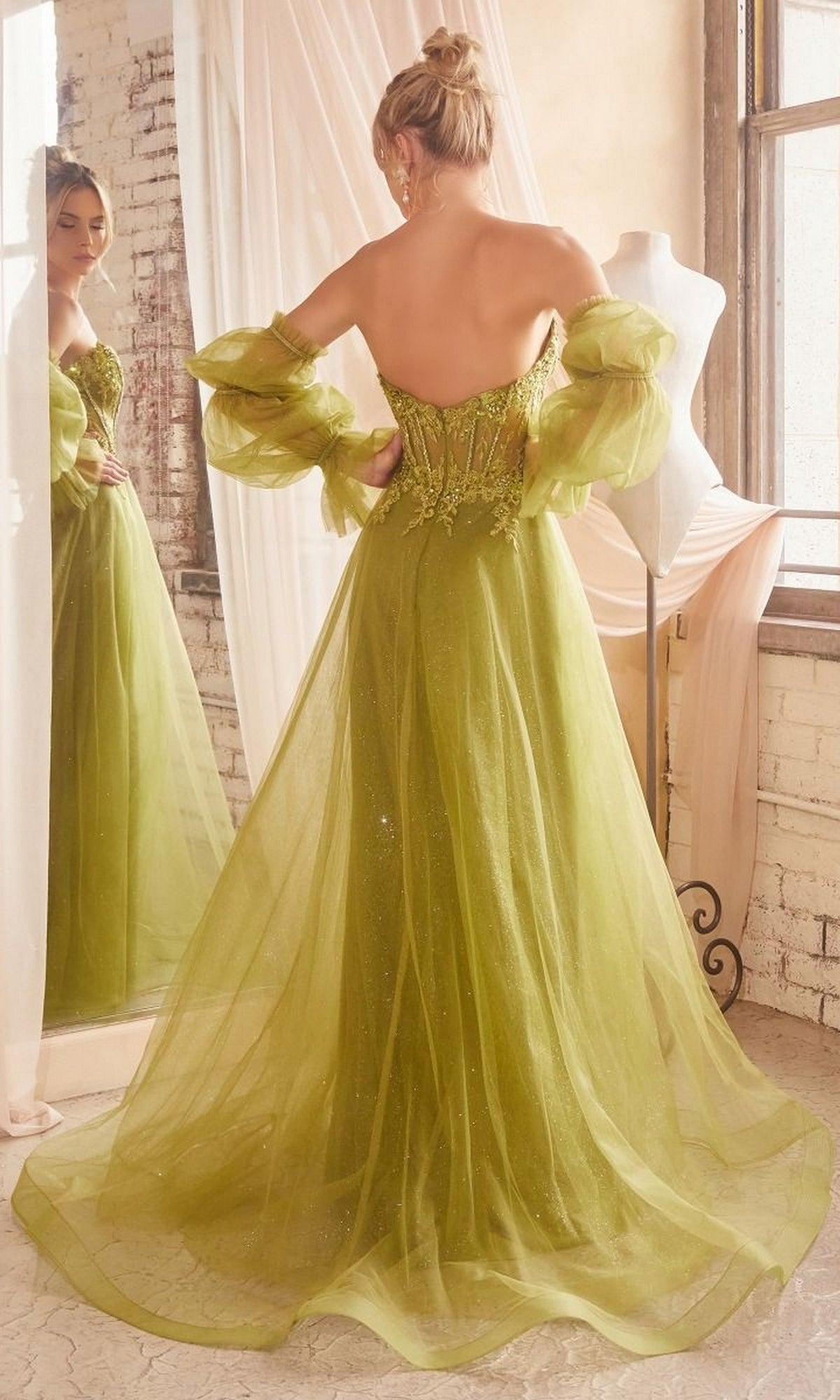 A woman in the Long Sleeve Strapless Long A-Line Prom Dress CD830 stands with her back to the camera, gazing at her reflection in a softly lit room.