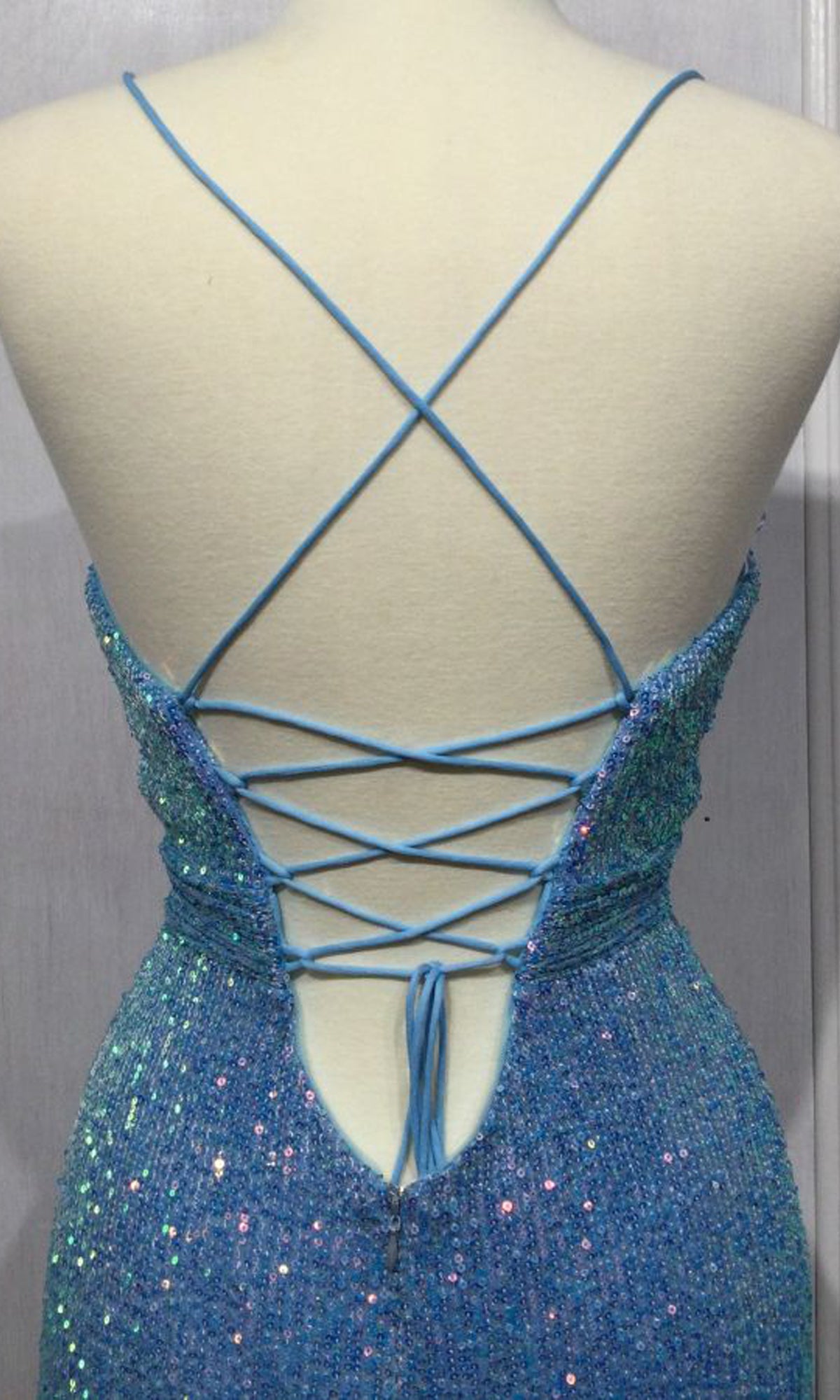 Back view of the Long Yellow Sequin Prom Dress with Cut Outs CH115, featuring crisscross lace-up straps and a daring open back design.