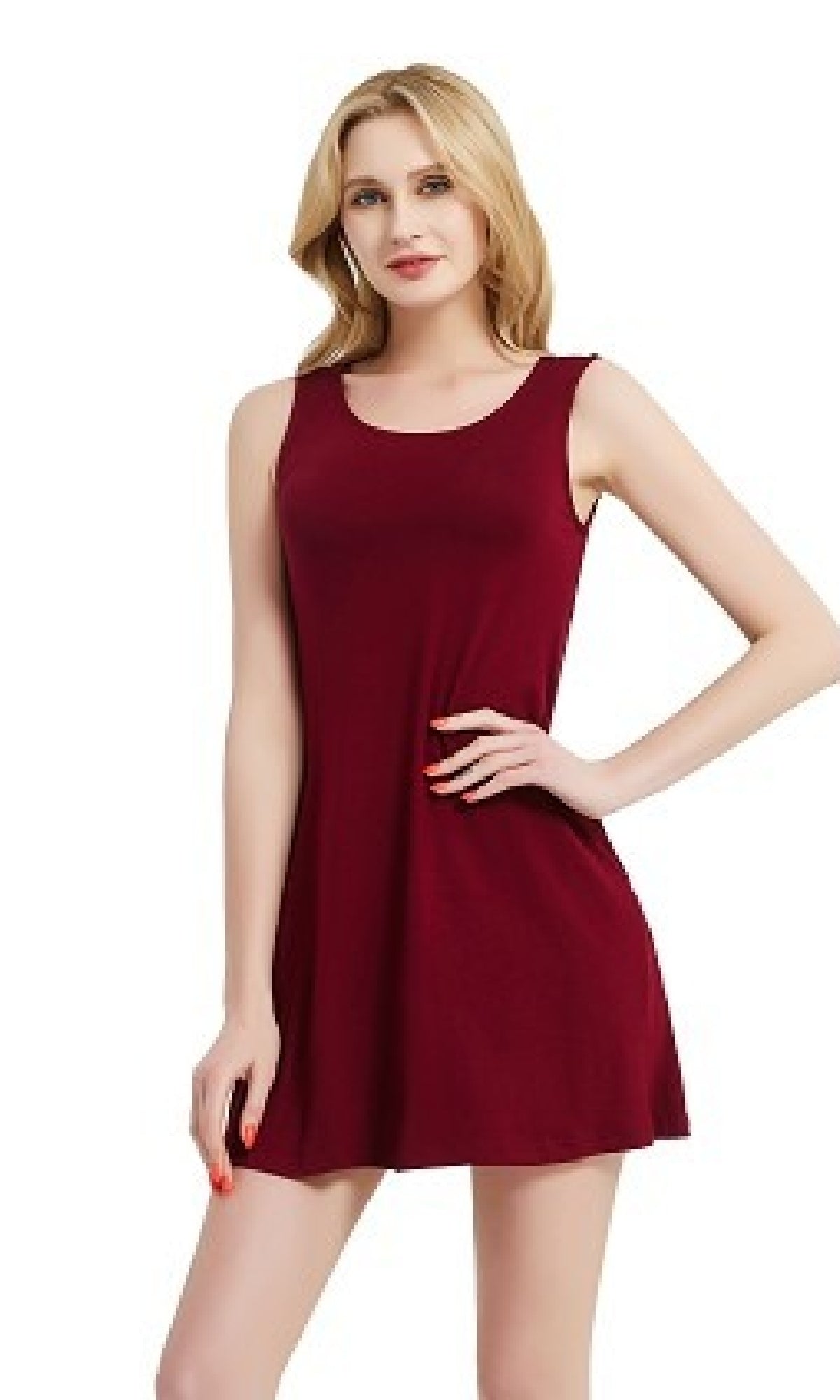 A woman models the Sleeveless Casual Short T-Shirt Dress with Pockets, standing with one hand on her hip against a plain white background.
