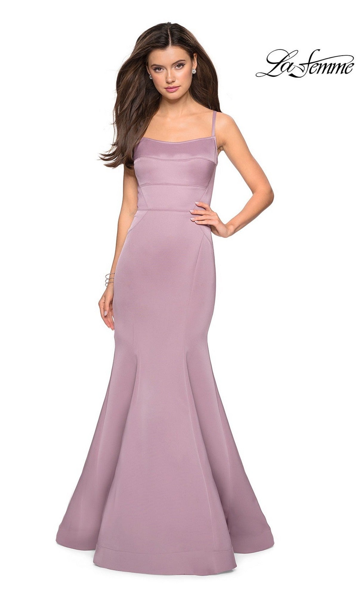 A woman wears the La Femme Square-Neck Simple Long Prom Dress 27524—a sleeveless, fitted mauve gown with thin straps and a mermaid skirt—standing against a white background with the La Femme logo in the top right corner.