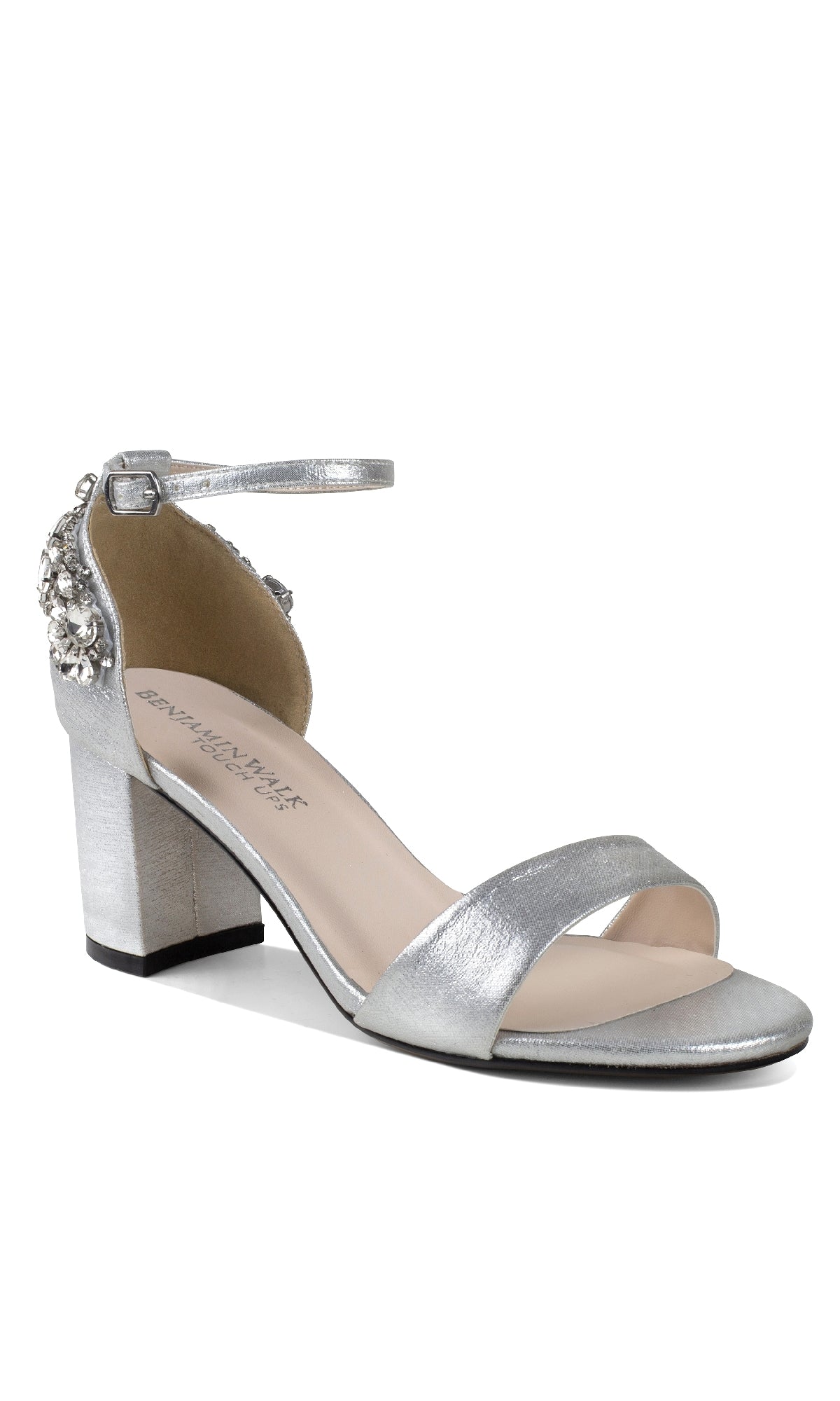 The Olivia Silver Shimmer Prom Shoes (Touch Ups 4636) feature a silver block heel, ankle strap, jeweled heel accents, open toe, and a single front strap—perfect as stylish silver prom shoes.