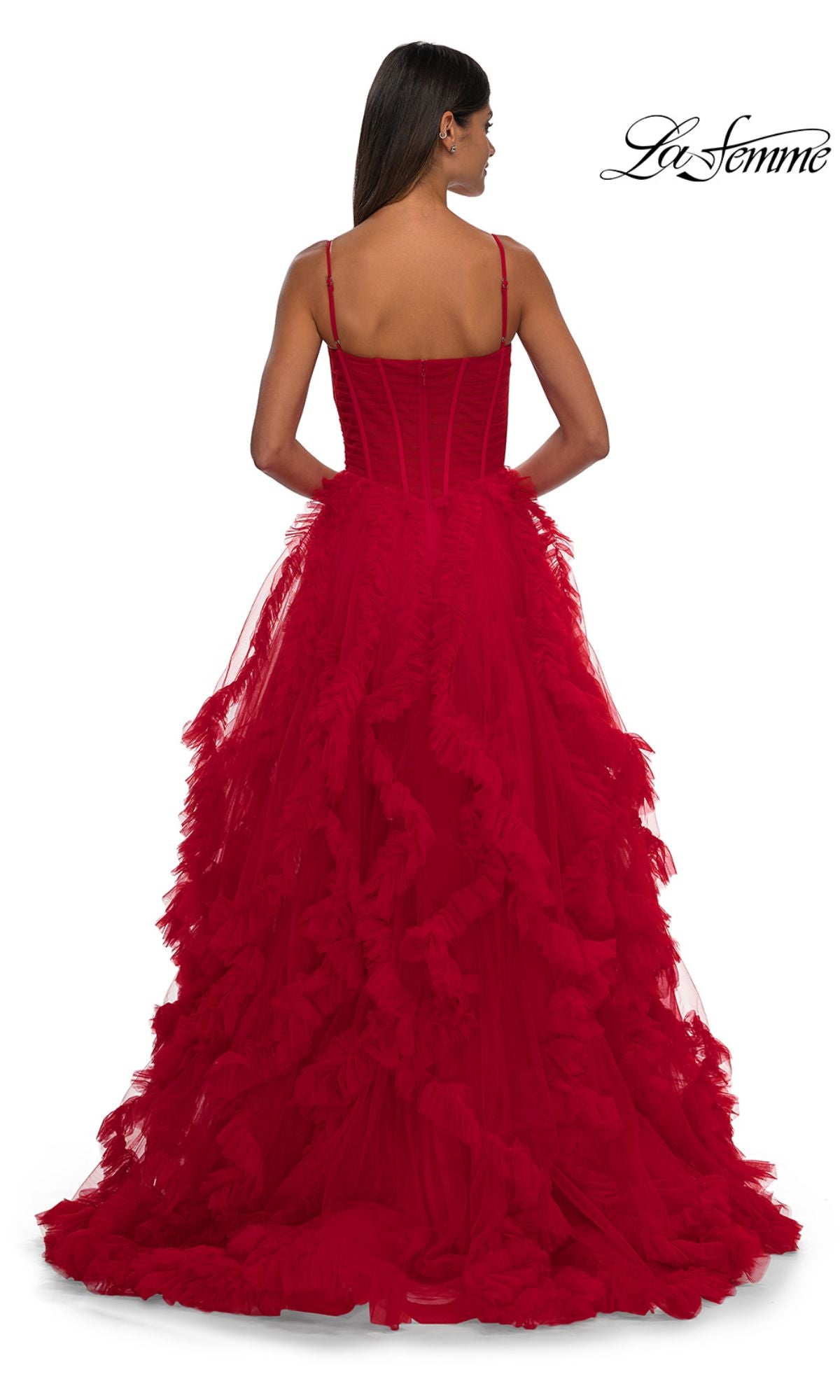 A woman with long dark hair is shown from the back wearing the La Femme 32719 Ruffled-Tulle Long Prom Ball Gown, featuring thin straps and a lace corset bodice. The La Femme logo appears in the top right corner.