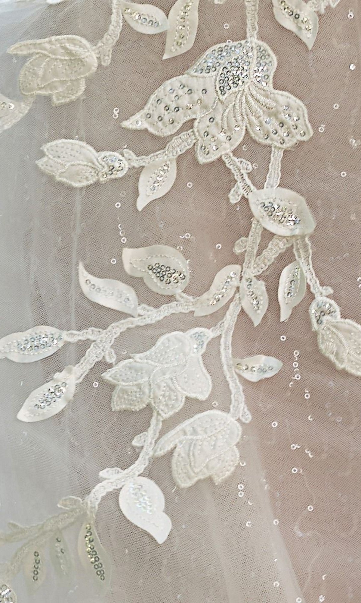A close-up of the Long Wedding Dress: Andrea and Leo WL070 showcases delicate white lace with 3D floral appliques.