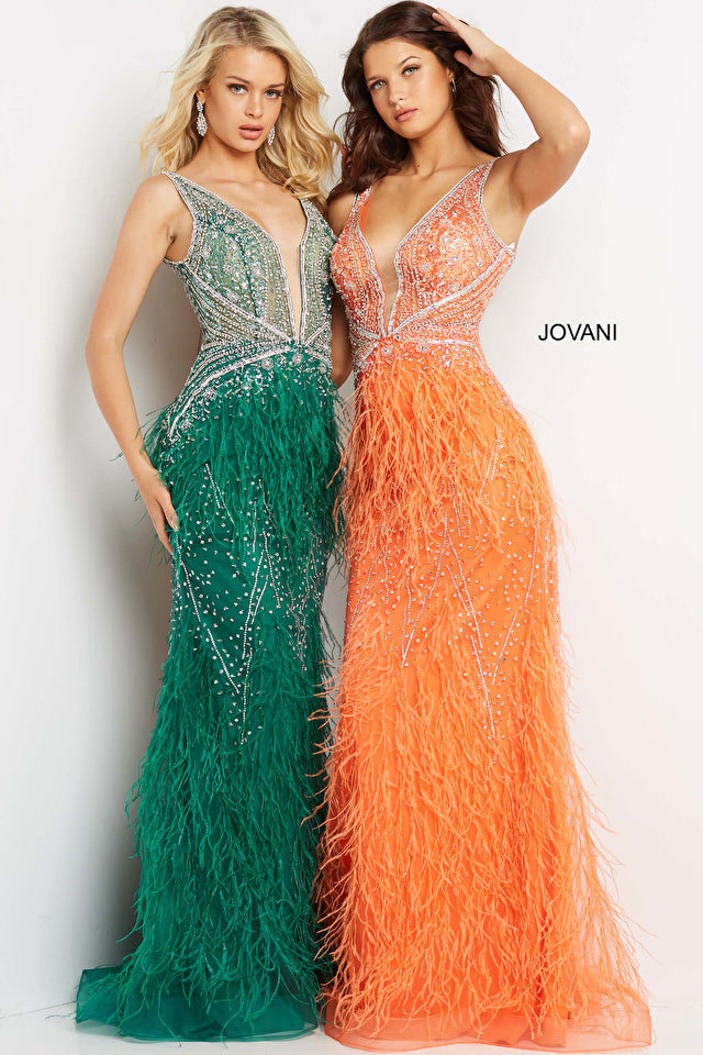 Two women stand side by side wearing Jovani Sheer-Bodice Long Prom Dresses with feathered skirts—one green, the other orange.