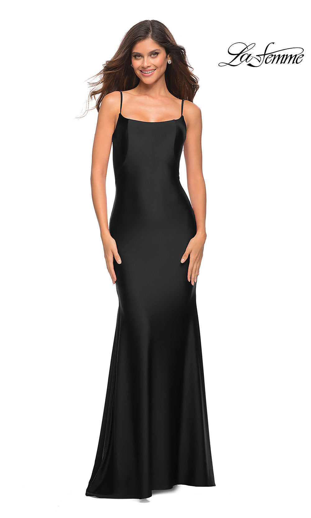 A woman in the La Femme Backless Long Prom Dress with Train in black, featuring thin straps and a fitted silhouette, smiles against a white background. The La Femme logo is visible in the top right corner.