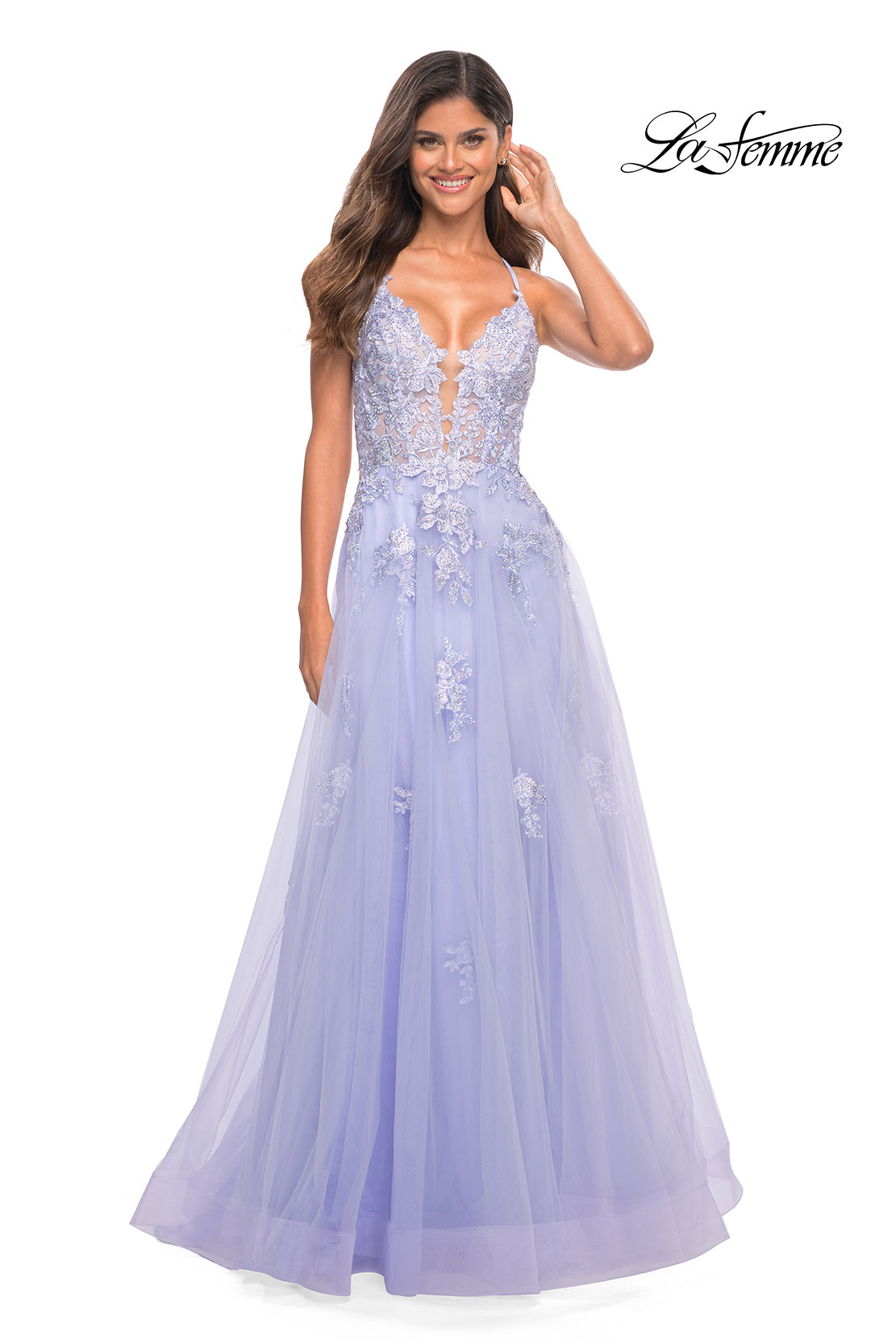 A woman wearing a lavender La Femme Open-Back Long Ball Gown with lace stands against a white background.