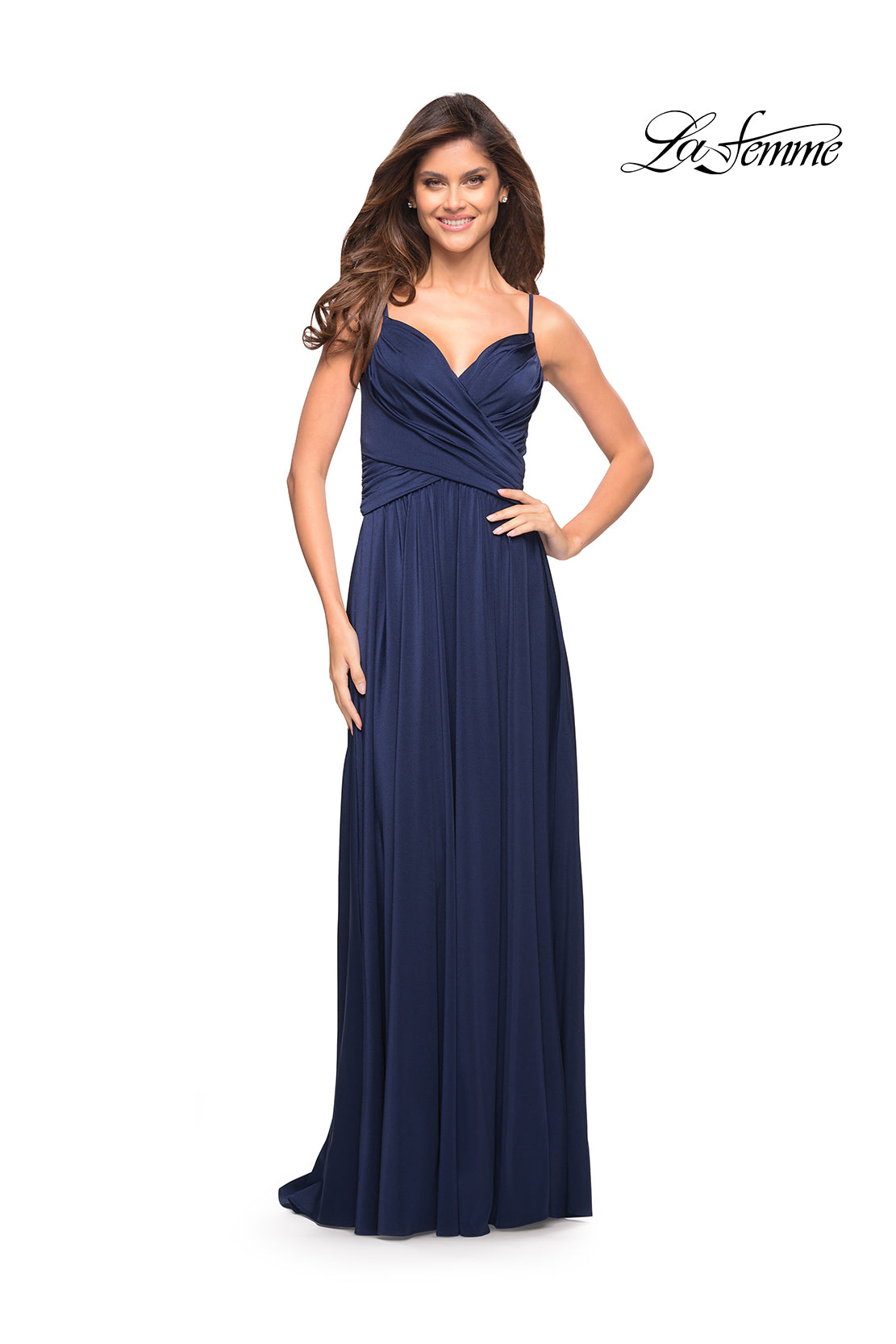 A woman models the La Femme Simple Elegant Long Formal Prom Dress, a navy blue floor-length A-line gown with spaghetti straps and a ruched bodice. The background is plain white with