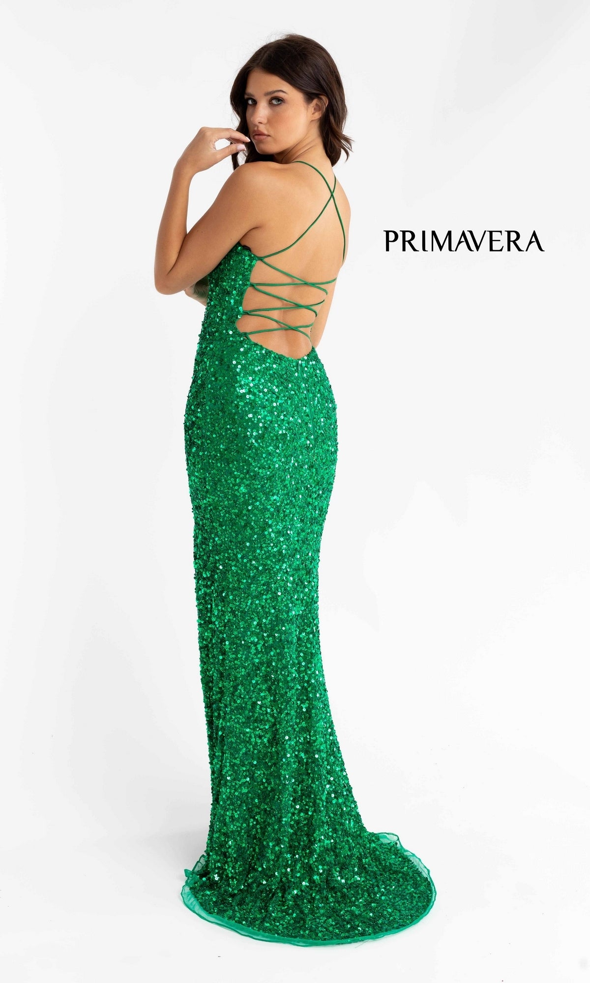 Woman wearing the Backless Bright Color Long Sequin Prom Dress 3290B with crisscross straps, standing against a white background. The word