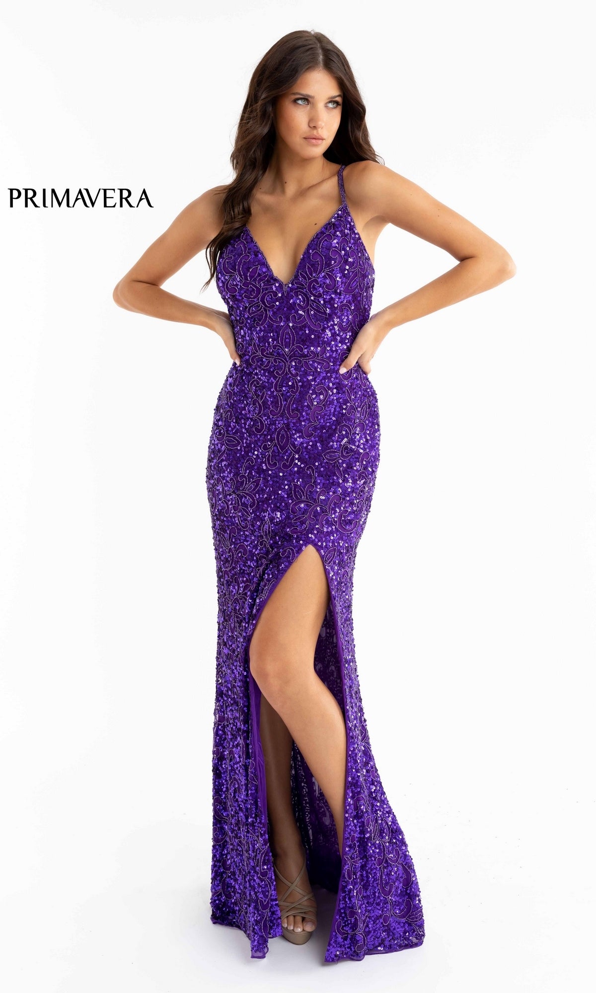 A woman stands against a white background wearing the Dark Sequin-Pattern Long Prom Dress 3295D, a sleeveless fitted gown with a deep V neckline and high front slit.