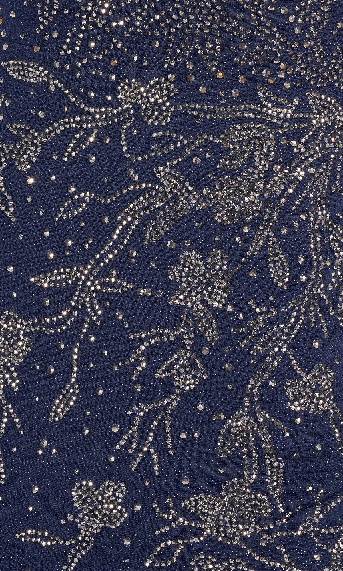 Close-up of the Sparkle Jersey Formal Dress: Ellie Wilde EW122028 in dark blue, featuring intricate silver bead and sequin embroidery in a formal floral pattern.