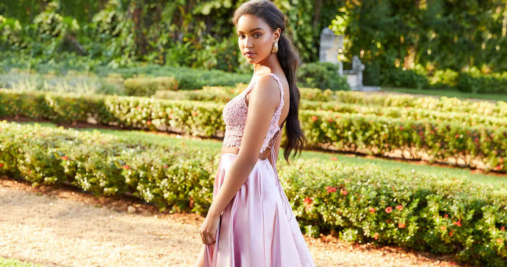 A girl in a pink prom dress purchased online.