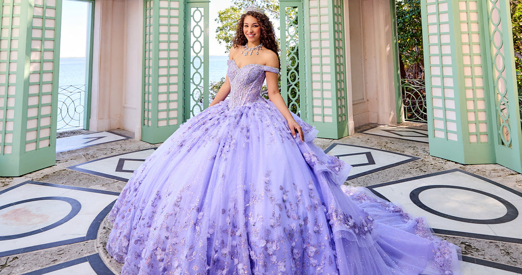 Teen girl wearing a lilac purple corset quinceanera dress with 3-D flowers and glittering tiers.
