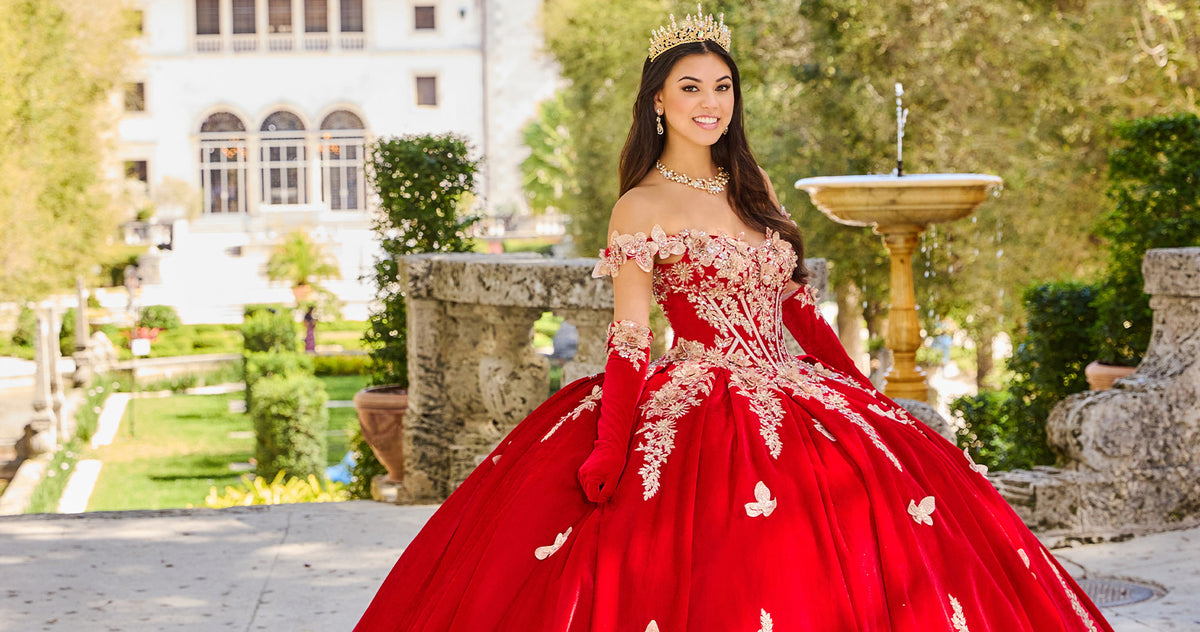 Teen girl wearing a vibrant red quince ball gown and matching elbow gloves.