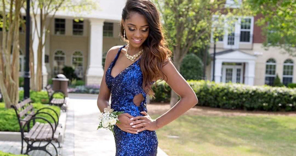 Teen girl wearing a blue sequin spring formal dress with small side cut out.