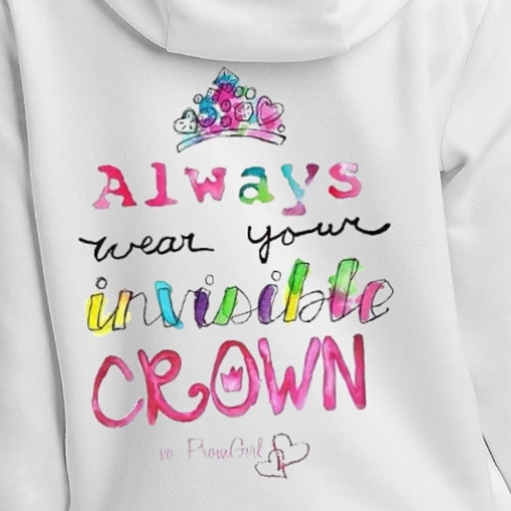 Close up of the back of a white hoodie with rainbow lettering that says 