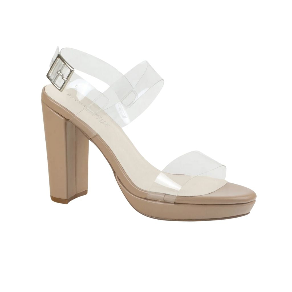 Close up of a high-heel formal prom shoes with clear straps and a clear buckle secured around the heel.