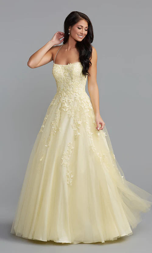 Yellow prom dress with a full floor-length ball gown skirt.