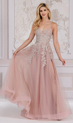 A woman poses elegantly in an ornate, light-colored room wearing the Floral-Embroidered Long A-Line Prom Dress TM1006, a blush pink, floor-length gown with floral embroidery and a tulle skirt.