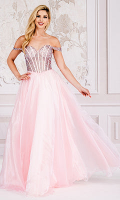 A woman stands indoors wearing the Organza Off-Shoulder Bodice Prom Ball Gown 7040, featuring a fitted, embellished bodice and a flowing skirt.