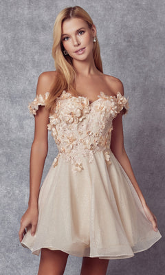 A woman models the Floral Off-the-Shoulder Short Homecoming Dress 861, featuring 3-D flowers, against a gray textured background.