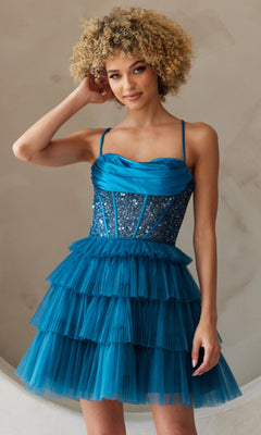 A woman stands against a neutral background wearing the Beaded-Bodice Short Ruffled Hoco Dress BZ9023S, featuring a sequined corset-style bodice and layered tulle skirt.