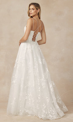A woman wearing the Embroidered-Lace Long A-Line Prom Ball Gown 279, featuring a fitted bodice, crisscross back straps, and a flowing skirt, stands against a neutral background.