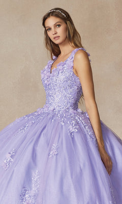 A woman wearing the Juliet 1437 Lilac Purple Quinceañera Dress with floral lace appliqués and a tiara stands against a neutral background.