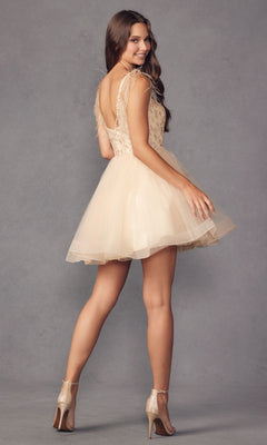 A woman wearing the Short Babydoll Homecoming Dress with Feathers 881 and high heels stands against a plain gray background, glancing back over her shoulder.