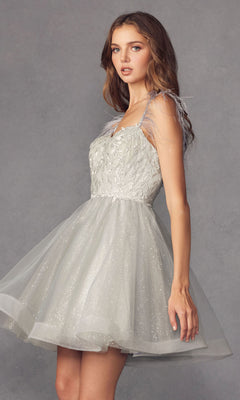 A woman stands against a plain gray background wearing the Short Babydoll Homecoming Dress with Feathers 881.