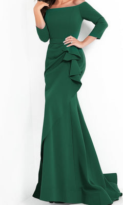 A woman wearing the Jovani Mother-of-the-Bride Long Formal Dress 00446 in emerald, featuring an off-the-shoulder neckline, three-quarter sleeves, a floor-length silhouette, and draped detailing on the skirt.