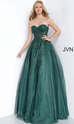 A woman wearing the Jovani 00915 Long Prom Dress in emerald, a strapless floor-length ballgown featuring intricate floral lace details and a full tulle skirt, stands against a plain white background.