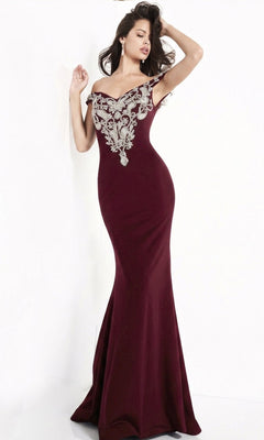A woman models the Jovani Embroidered Off-Shoulder Prom Dress 02576 in burgundy, showcasing its fitted silhouette and intricate silver embroidery on the bodice, against a plain white background.