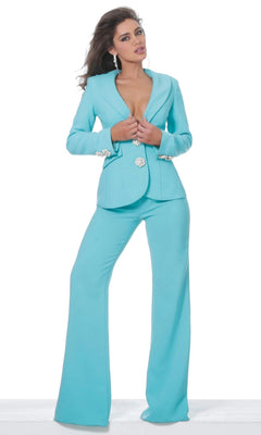 A woman wearing the turquoise Jovani 02637 long jumpsuit with wide-leg pants and jeweled buttons, paired with statement earrings, poses against a plain white background.