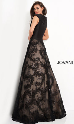 A woman in the Jovani Mikado-Bodice Long Black Prom Dress 03330, featuring a sleeveless design and sheer floral lace skirt overlay, stands facing away against a white background. The word "JOVANI" appears on the right.