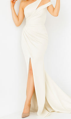 A woman wears the Jovani 04222 one-shoulder long mermaid prom dress in white, featuring a thigh-high slit and train, elegantly paired with beige high heels.