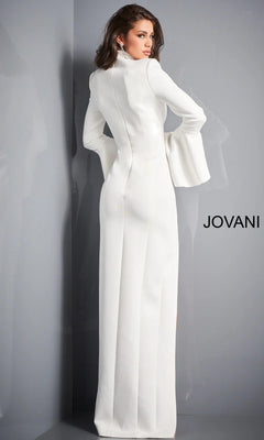 A woman stands facing away, her head turned to the side, wearing the Long Formal Dress: Jovani 04240—a white, long-sleeved, floor-length gown—next to a gray wall featuring the “JOVANI” logo.