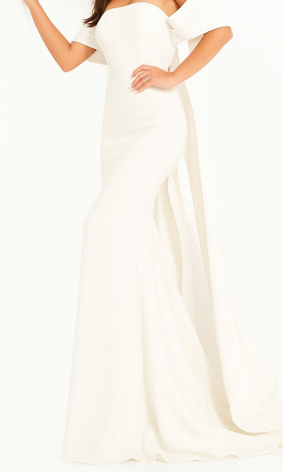 A woman poses against a plain white background wearing the Long Prom Dress by Jovani 04350 in ivory—a floor-length, off-the-shoulder formal gown featuring a fitted bodice and a flared skirt. Her left hand rests near her waist.