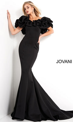 A woman poses by a white wall in the Jovani 04368 Off-Shoulder Long Mermaid Prom Dress in black, featuring dramatic ruffled sleeves; "JOVANI" is displayed on the right.