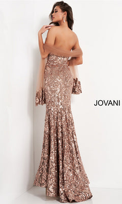 A woman poses with her back to the camera, wearing the Jovani Strapless Sequin Long Prom Dress 05054 in rose gold.
