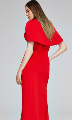 A woman with long straight hair poses in the Jovani 06538 Long Formal Dress, a fitted, floor-length designer gown featuring structured, cape-like shoulder detail.