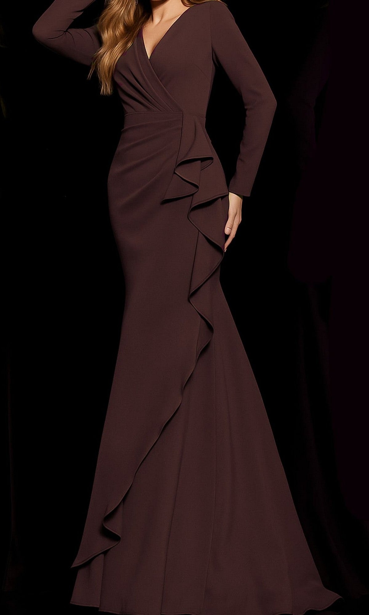 A woman wearing the Jovani 06995, a long-sleeve formal designer dress in plum, featuring a fitted silhouette and cascading ruffle detail down the front.