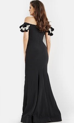 A woman stands with her back to the camera against a plain background, wearing the Long Prom Dress 07017 by Jovani—an elegant, off-the-shoulder formal gown with ruffled short sleeves.