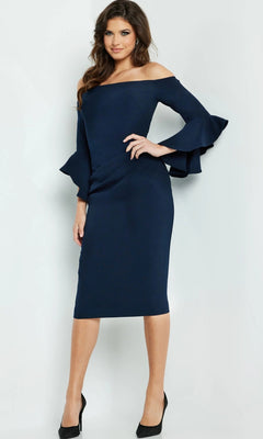 A woman wearing the Jovani 07066 short wedding guest dress in navy blue, featuring off-the-shoulder flared sleeves, paired with black heels and standing against a plain light background.
