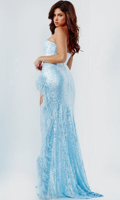 Woman wearing the Long Prom Dress 07068 by Jovani, a strapless sweetheart sequin gown with feather-trimmed slit, stands against a plain light background, looking over her shoulder.