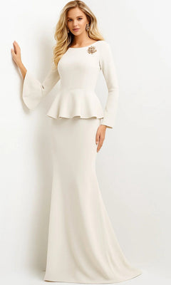 A woman models the Long Formal Dress: Jovani 07131 in ivory, showcasing its fitted trumpet silhouette with flared sleeves and a peplum waist, as she poses against a plain white background.