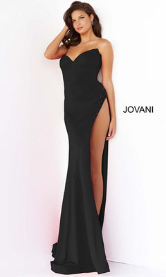 A woman poses in the Long Prom Dress 07138 by Jovani, a strapless formal gown with a sweetheart neckline and embellished high slit, set against a plain background featuring the "JOVANI" logo.