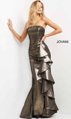 A woman wearing the Jovani 07582 long formal dress stands against a white background. This strapless metallic gown features ruffled side detailing, a fitted silhouette, and a subtle mermaid flare at the bottom.