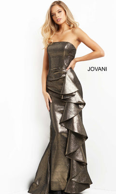 A woman stands against a white background wearing the Jovani 07582 long formal dress, a strapless metallic gown featuring a dramatic ruffled side detail that evokes the elegance of a mermaid silhouette. The word “Jovani” appears beside her.