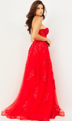 Woman modeling the Jovani Strapless Long Lace A-Line Prom Dress 07901 with floral embroidery, standing against a plain white background and looking over her shoulder.