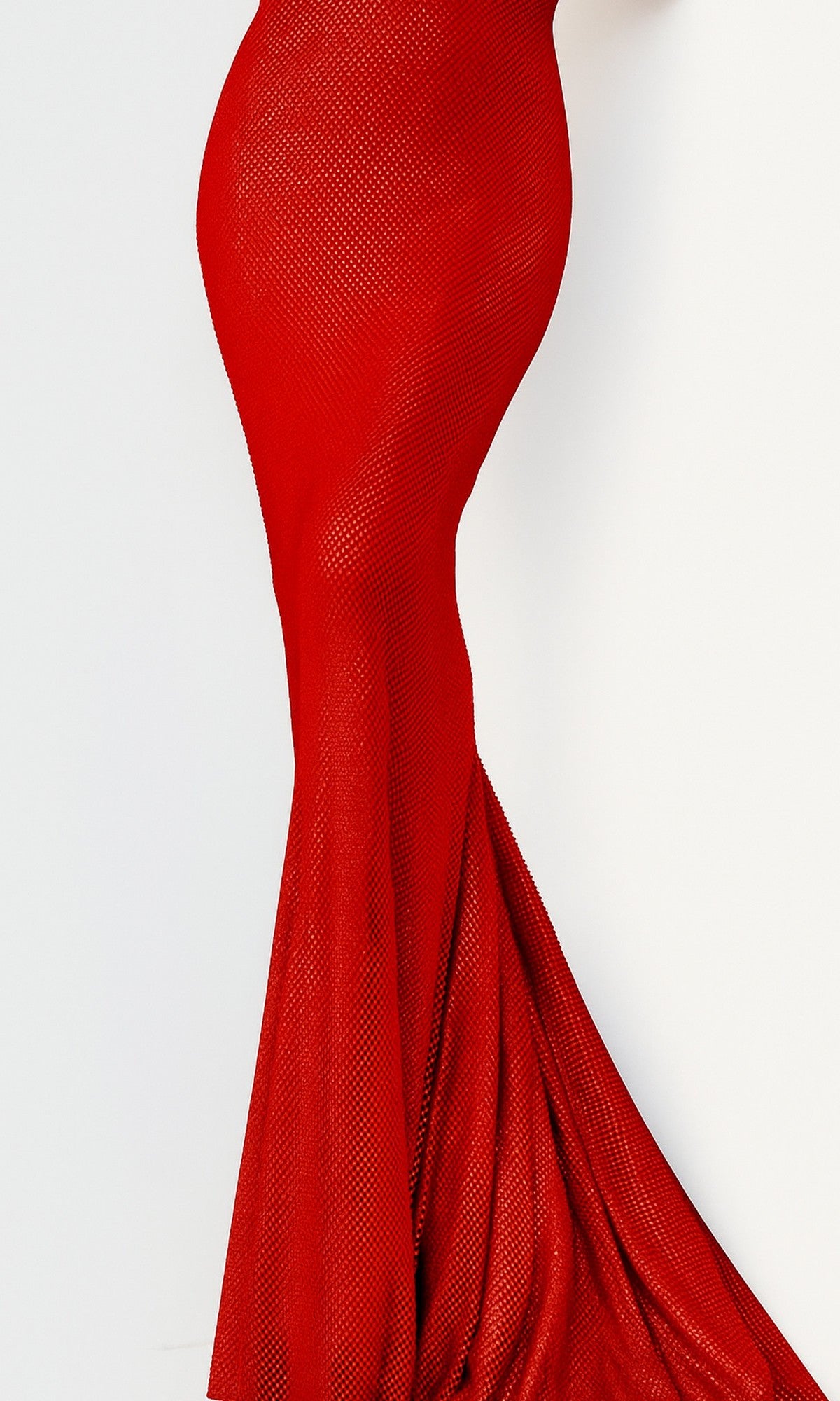 A close-up of a person wearing the Jovani 08139 Embellished Long V-Neck Prom Dress in red, shown from the waist down against a plain white background.